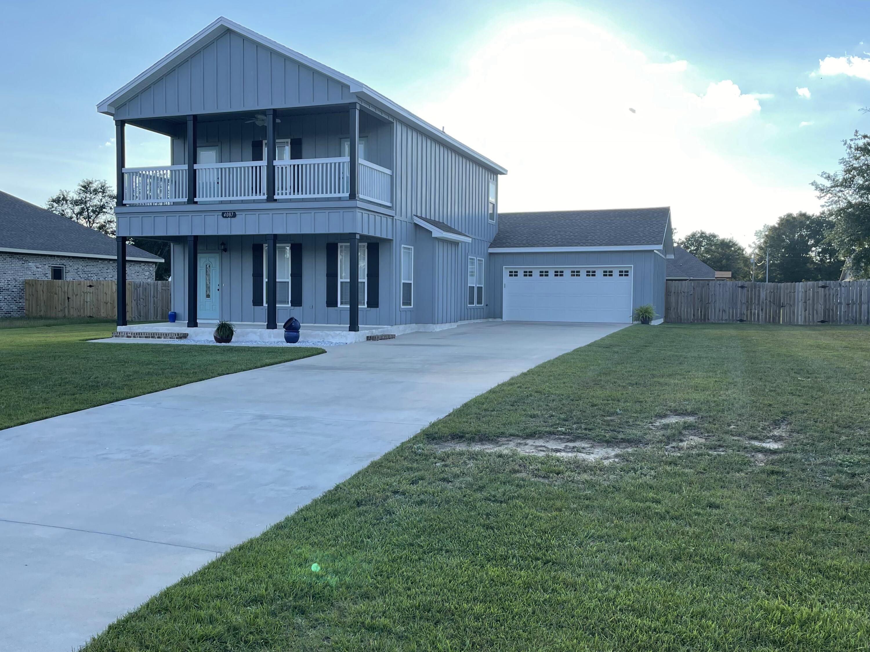 4087 Happy Trails Road Crestview, FL 32539 - Photo 4 of 30 a front view of a house with a yard