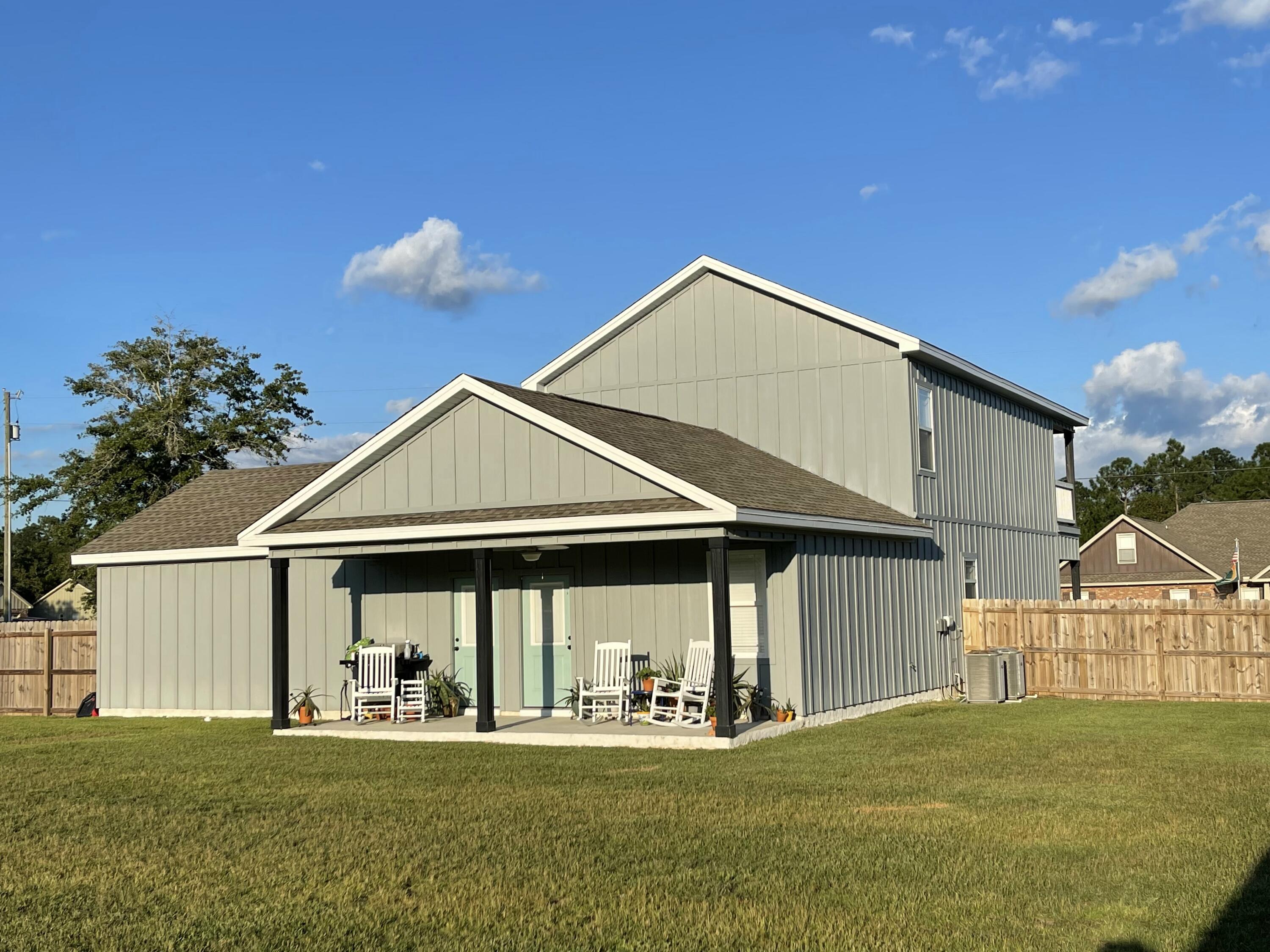 4087 Happy Trails Road Crestview, FL 32539 - Photo 5 of 30 a front view of a house with a yard