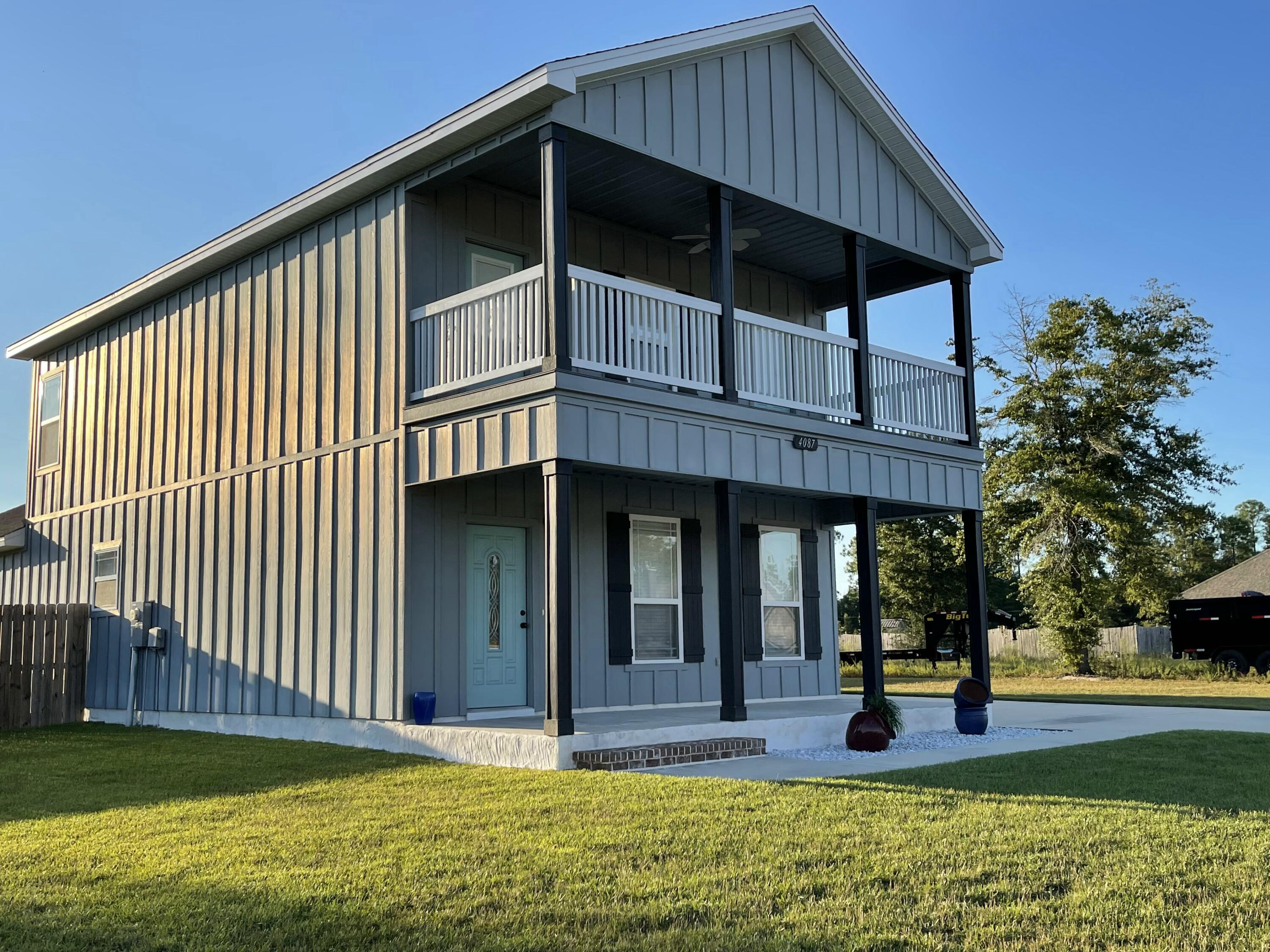 4087 Happy Trails Road Crestview, FL 32539 - Photo 8 of 30 a view of a house with backyard and porch
