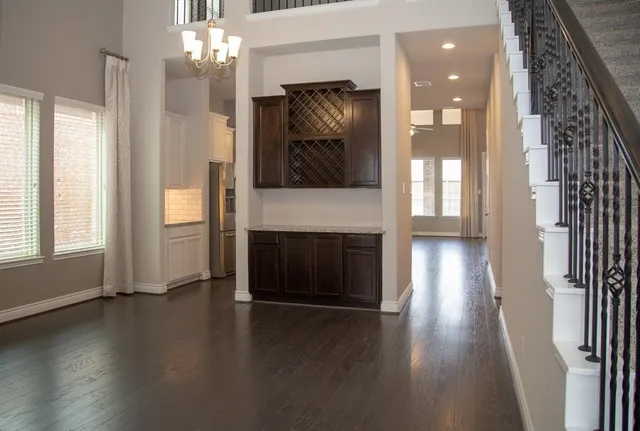 an entryway and livingroom with fireplace
