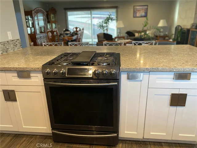 a kitchen with a stove and a microwave