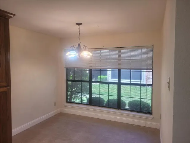 a view of empty room with windows