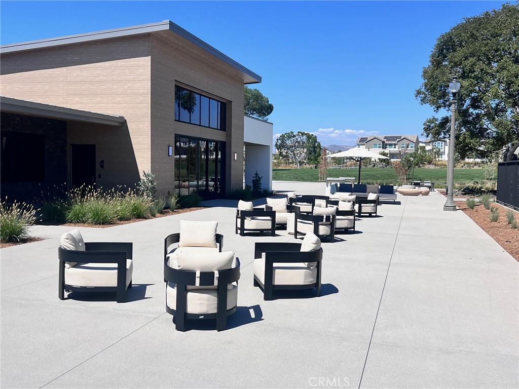 114 Draw Irvine, CA 92618 - Photo 31 of 48 a living room with patio furniture and a fire pit
