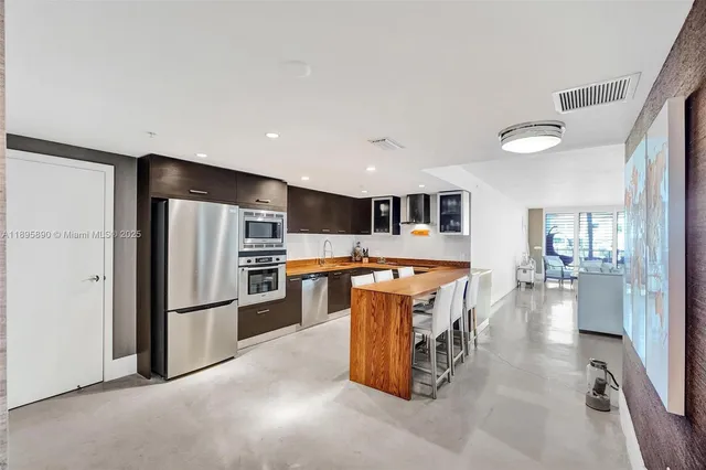 a bathroom with a tub double sink and mirror