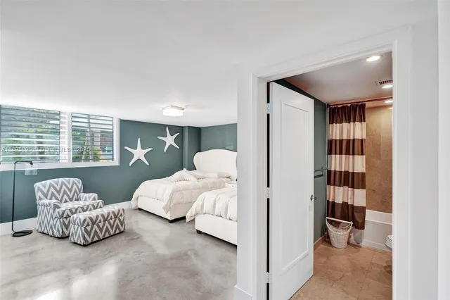 a view of a kitchen with a sink and cabinets