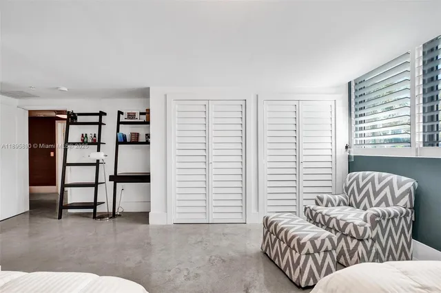 a view of a kitchen with kitchen island and a stove