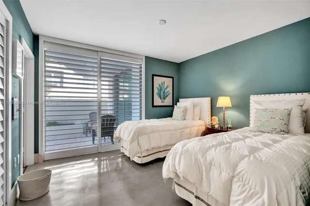 a view of residential houses with outdoor space and lake view