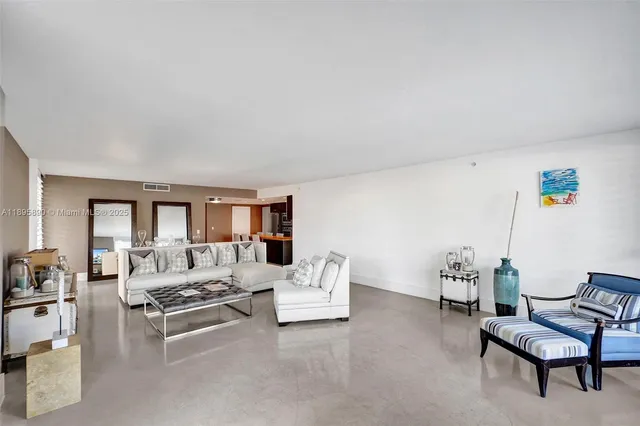 a kitchen with stainless steel appliances kitchen island granite countertop a sink and cabinets