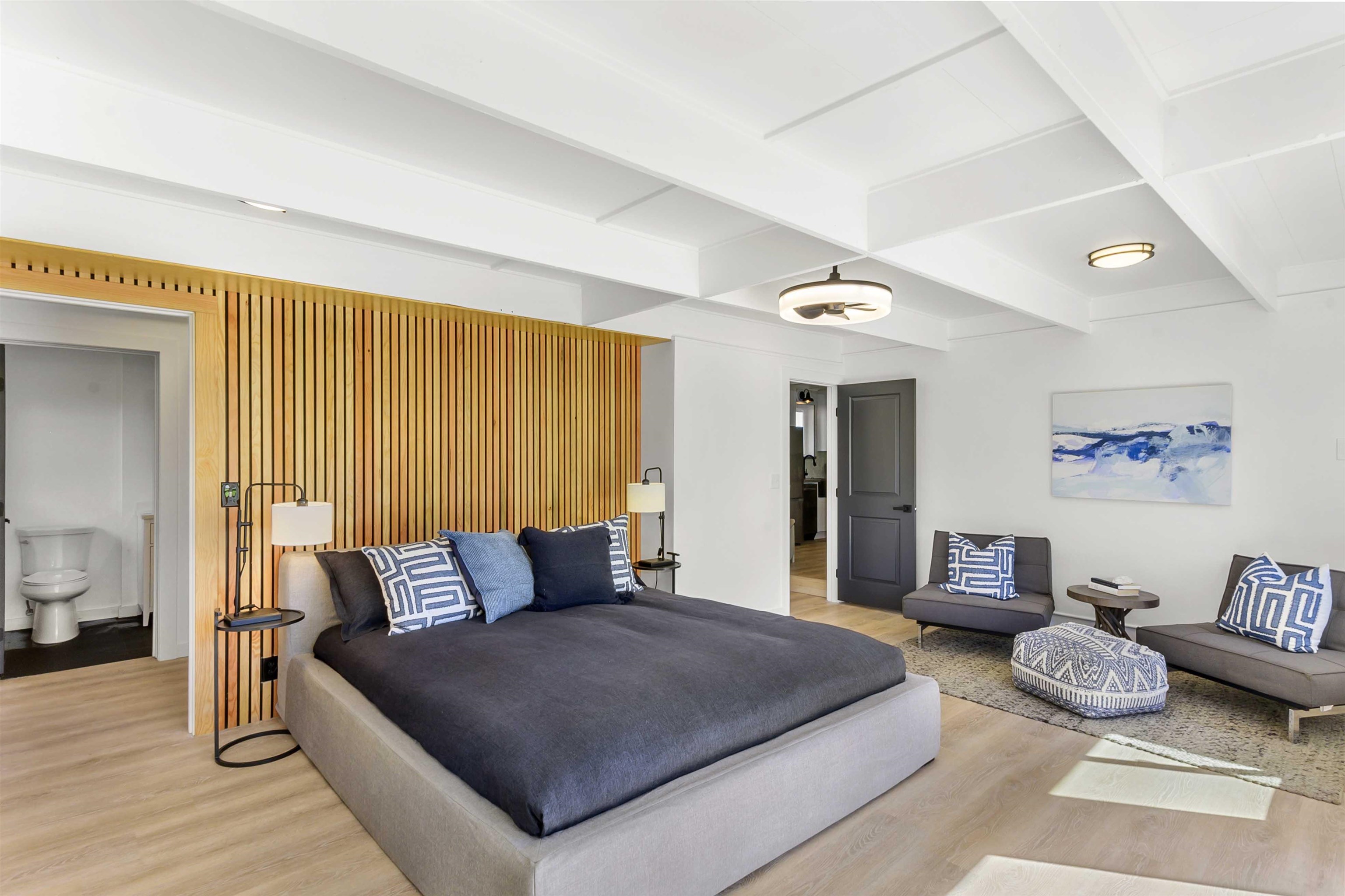 85 Honokaupu Place Haiku, HI 96708 - Photo 17 of 26 a bedroom with a large bed and a couch