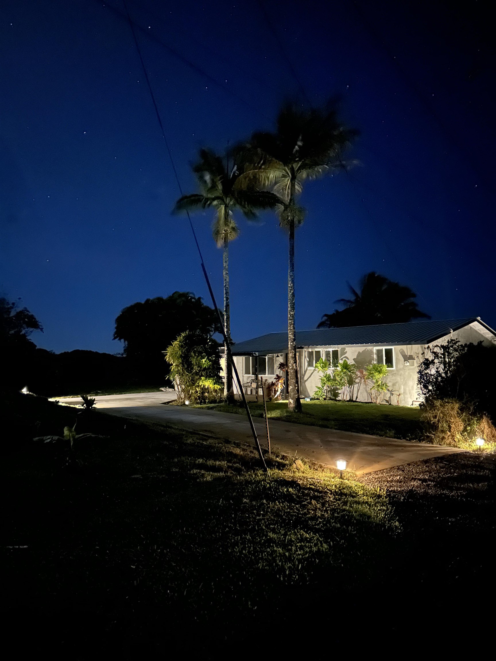 85 Honokaupu Place Haiku, HI 96708 - Photo 2 of 26 a view of a balcony with chair and potted plants