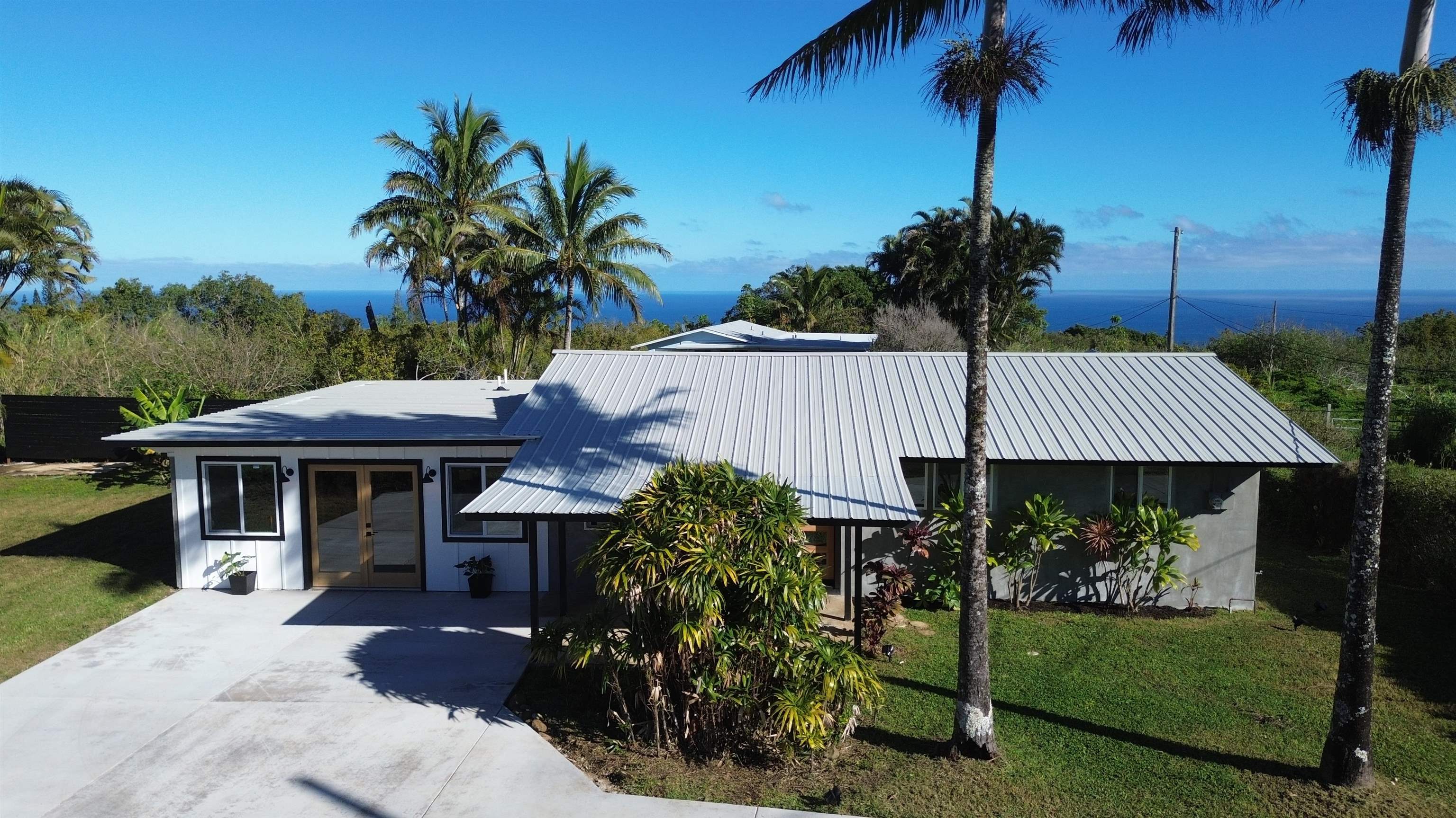 85 Honokaupu Place Haiku, HI 96708 - Photo 23 of 26 a view of a house with a yard and potted plants
