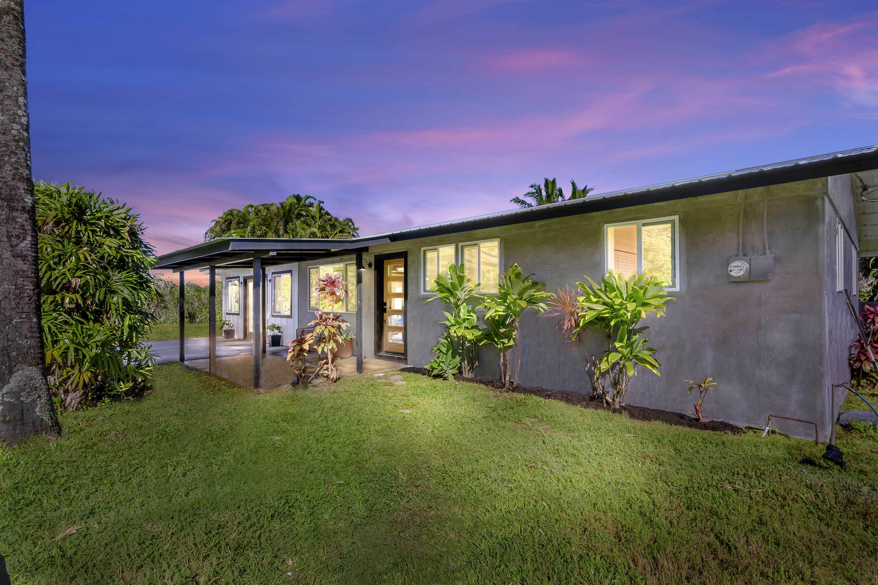 85 Honokaupu Place Haiku, HI 96708 - Photo 4 of 26 a front view of a house with garden