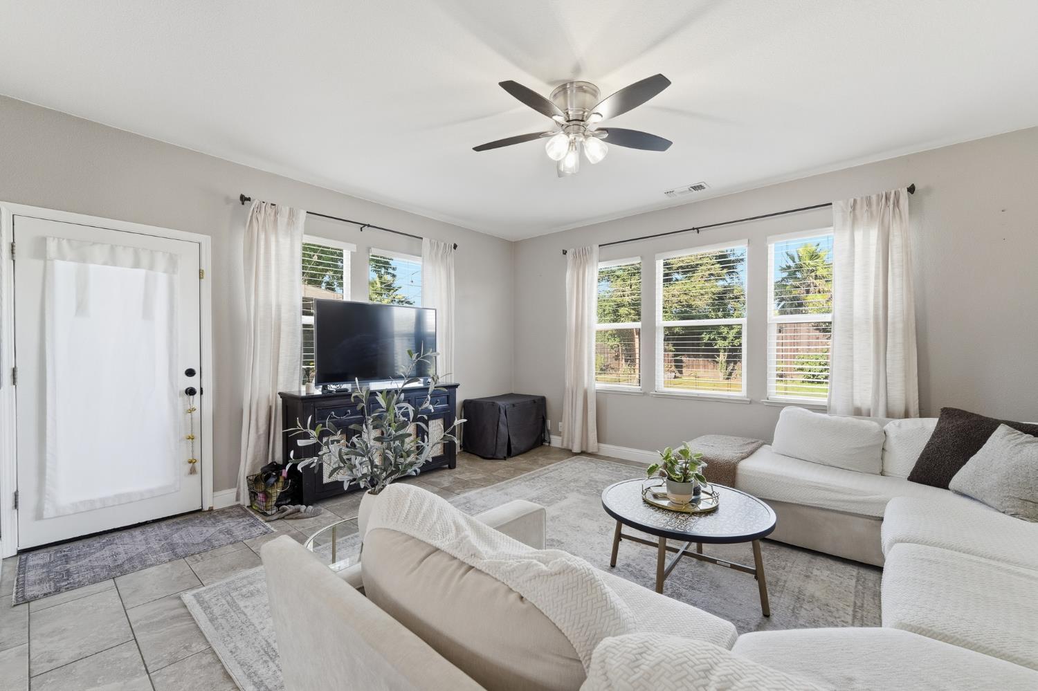 2220 Ellison Drive Modesto, CA 95355 - Photo 20 of 53 a living room with furniture and a flat screen tv