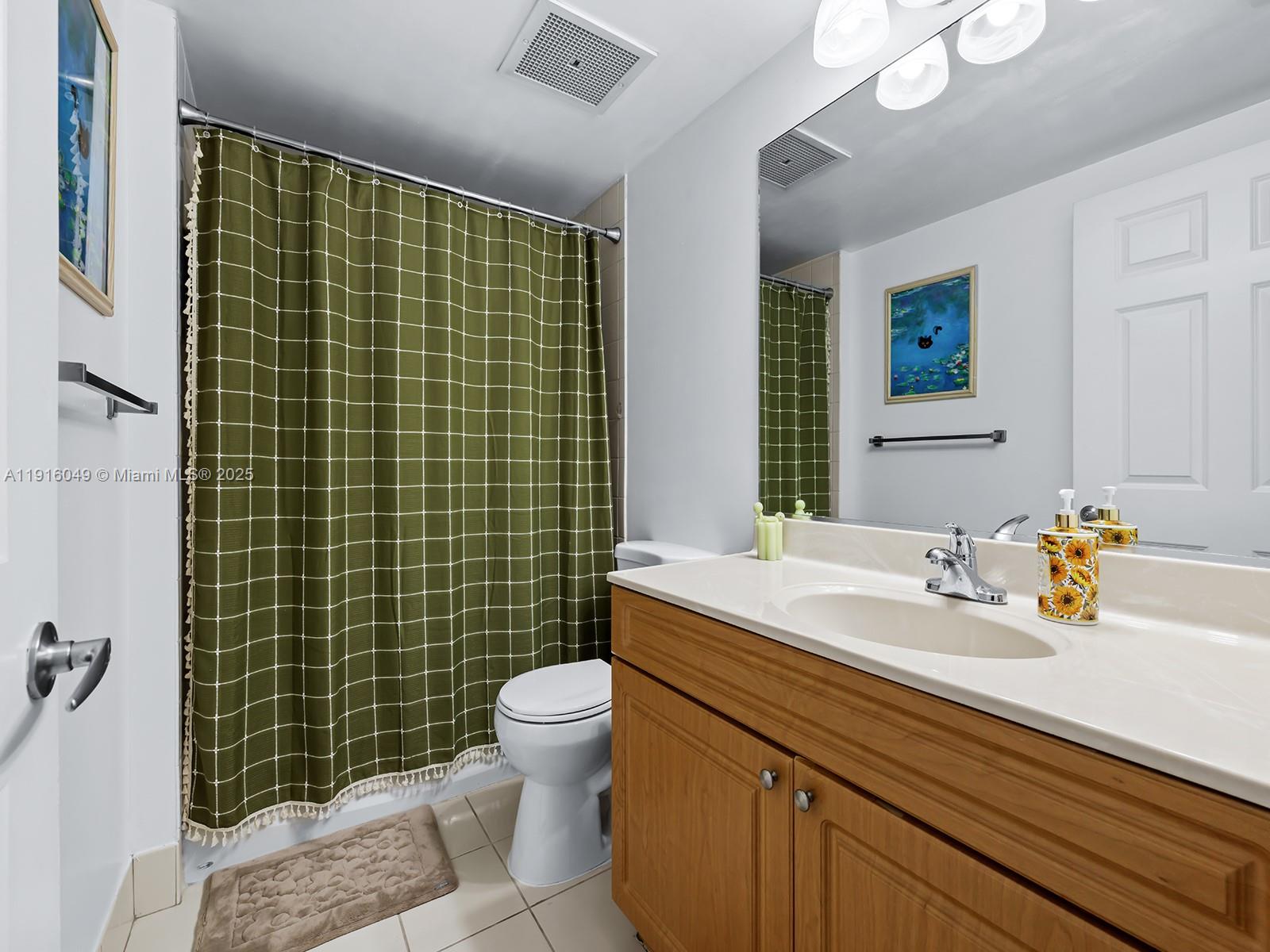 900 Southwest 8th Street, Unit 1208 Miami, FL 33130 - Photo 9 of 26 a bathroom with a sink toilet and shower