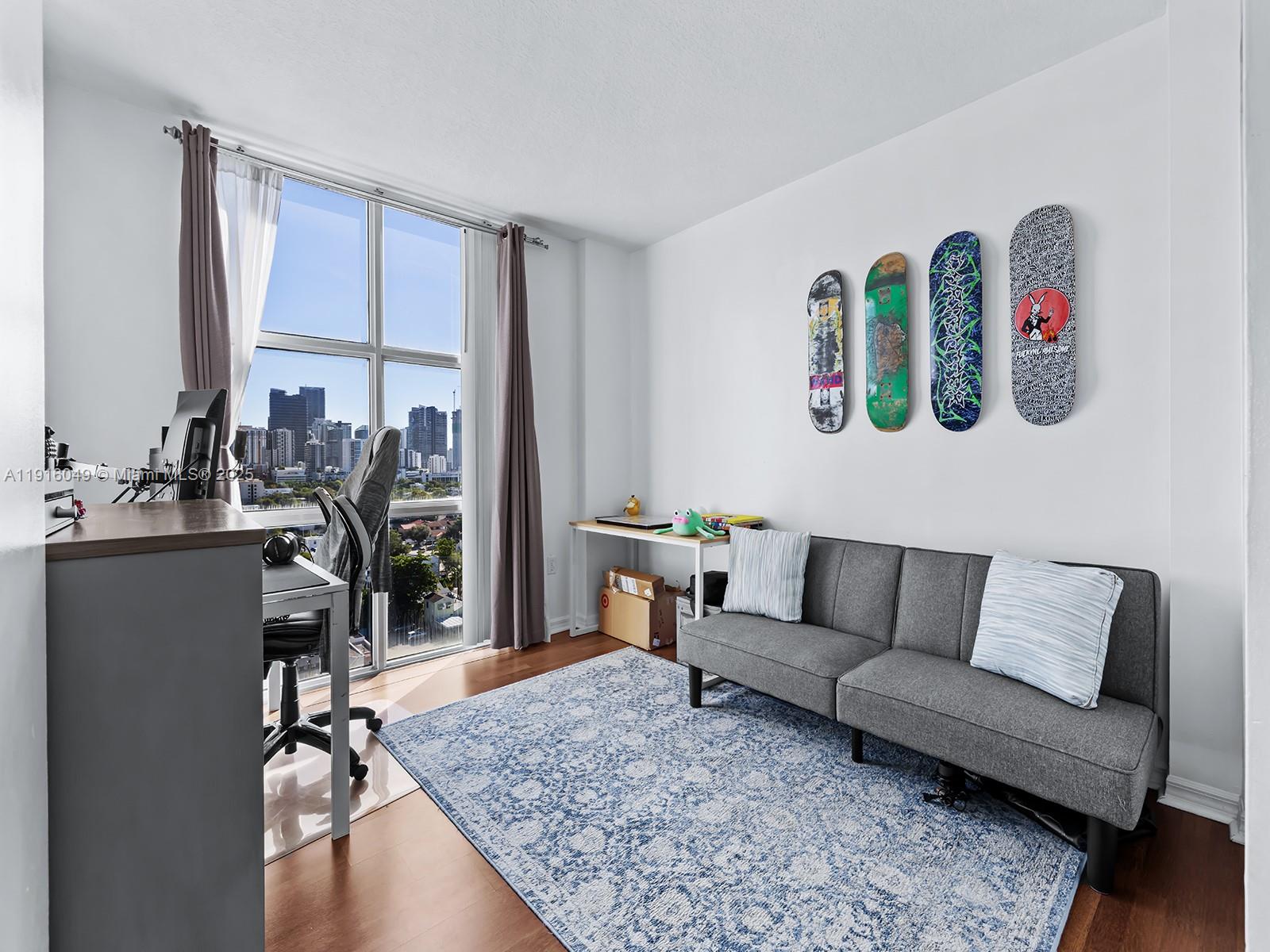 900 Southwest 8th Street, Unit 1208 Miami, FL 33130 - Photo 10 of 26 a living room with furniture and a table