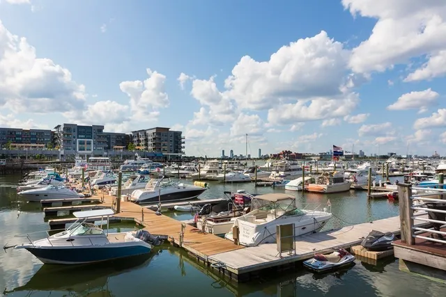 a view of a lake with cars parked