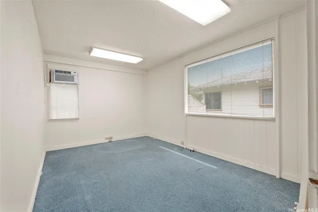 a view of room with racks on the wall and window