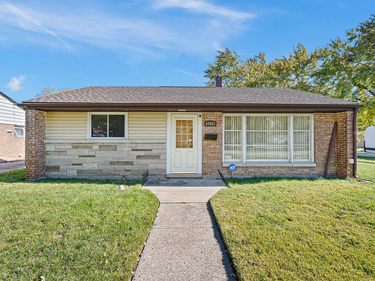17057 Park Avenue Lansing, IL 60438 - Photo 1 of 17 a front view of a house with a yard