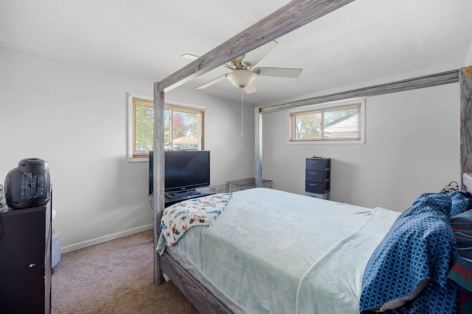 17057 Park Avenue Lansing, IL 60438 - Photo 12 of 17 a bedroom with a bed and a chandelier