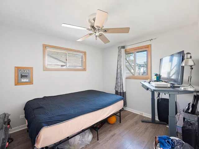 a bedroom with a bed and a table in it