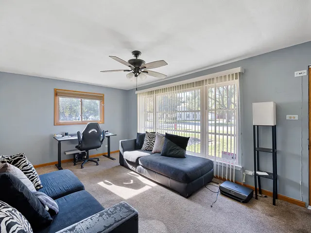 a living room with furniture and a window