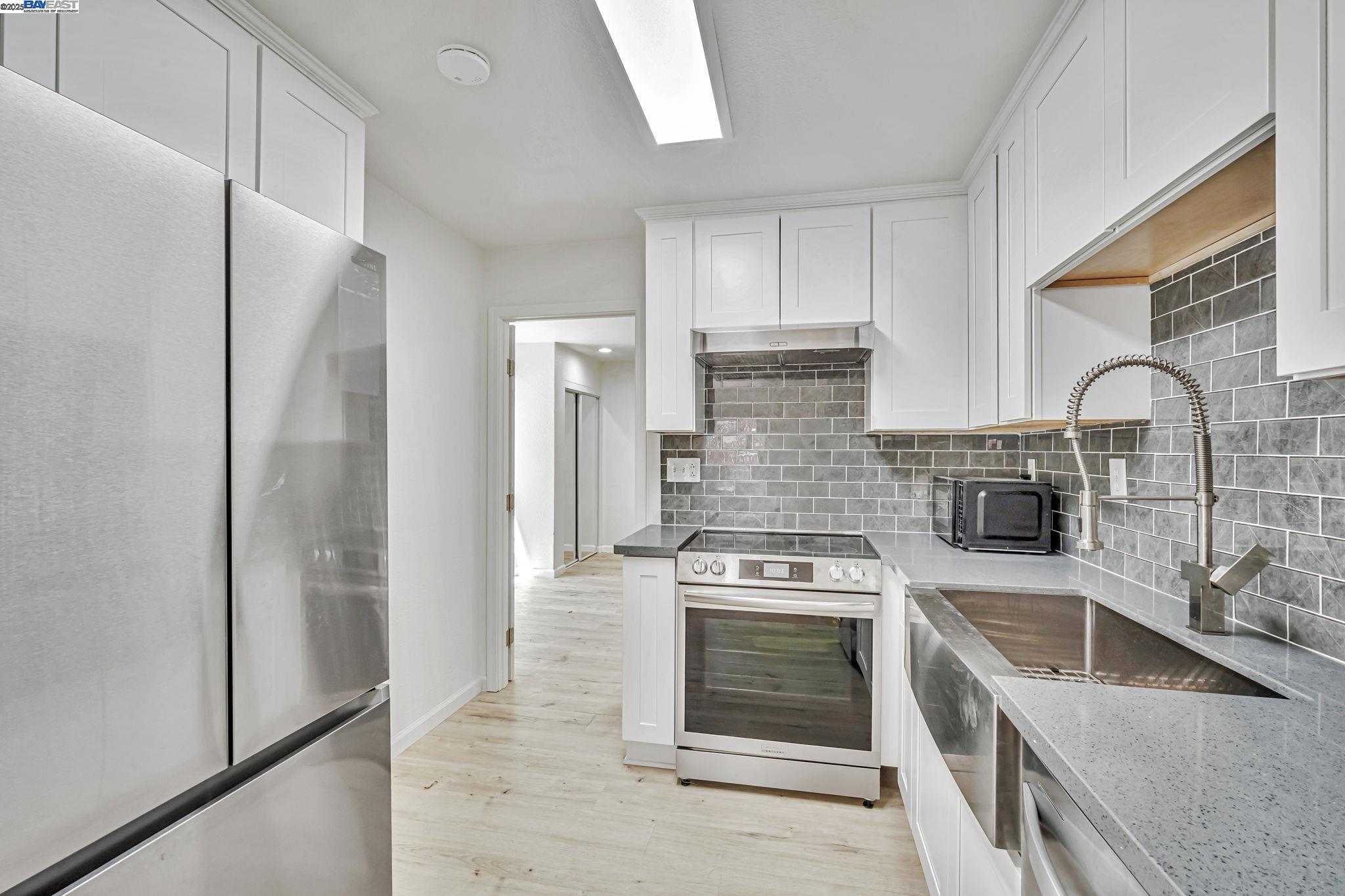 3920 Gravenstein Highway South Sebastopol, CA 95472 - Photo 13 of 48 a kitchen with a stove and a refrigerator
