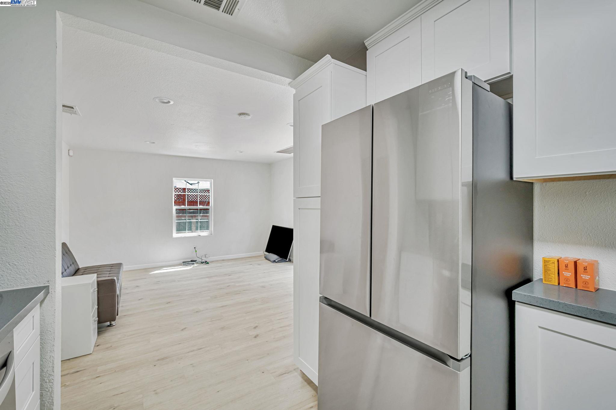 3920 Gravenstein Highway South Sebastopol, CA 95472 - Photo 15 of 48 a kitchen with stainless steel appliances a refrigerator and a window