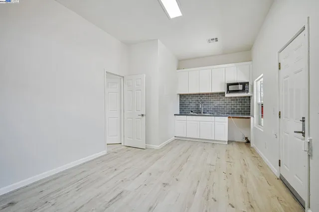 a view of a kitchen cabinets a sink and dishwasher in a white cabinet