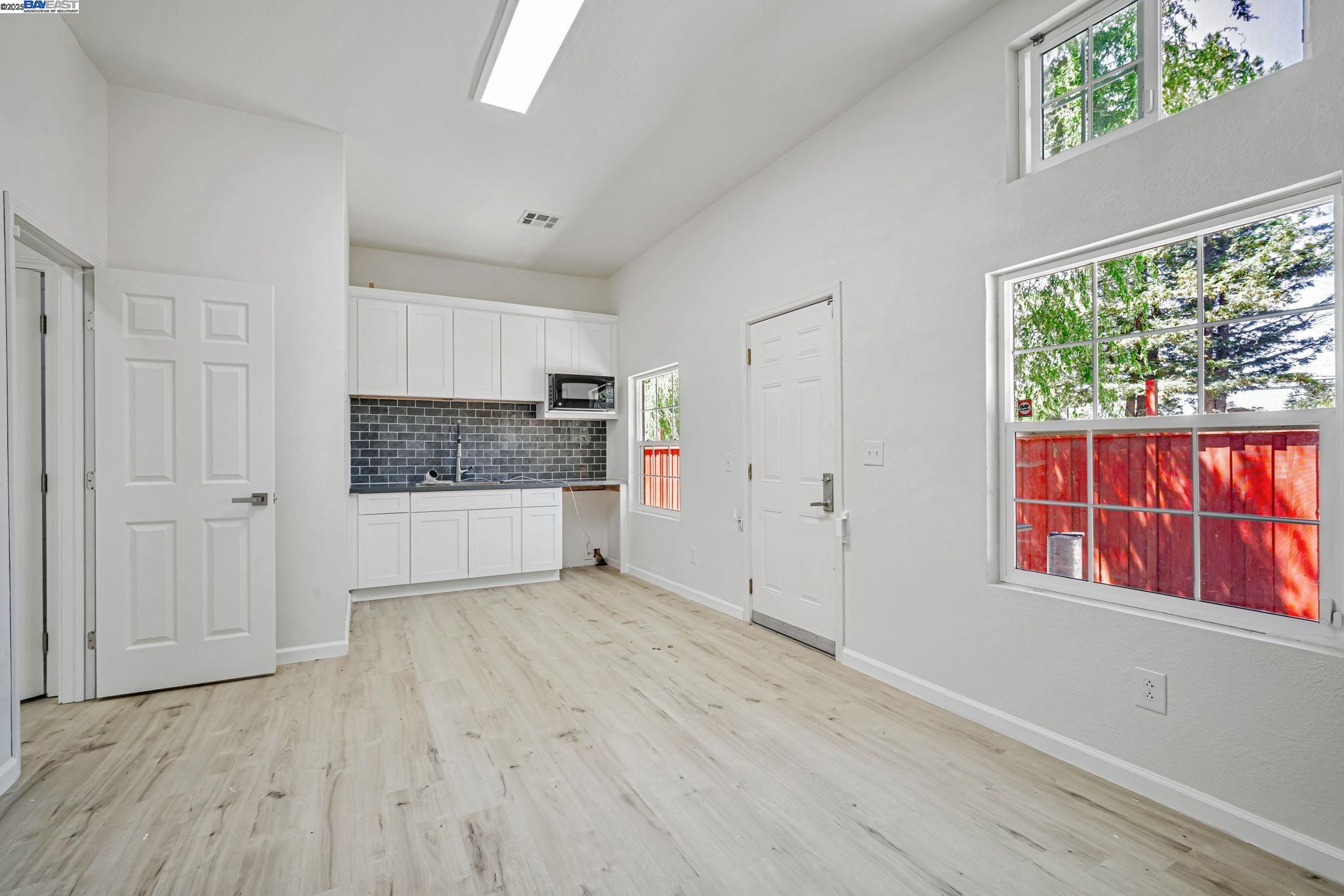 3920 Gravenstein Highway South Sebastopol, CA 95472 - Photo 17 of 48 a view of an empty room with a window and wooden floor
