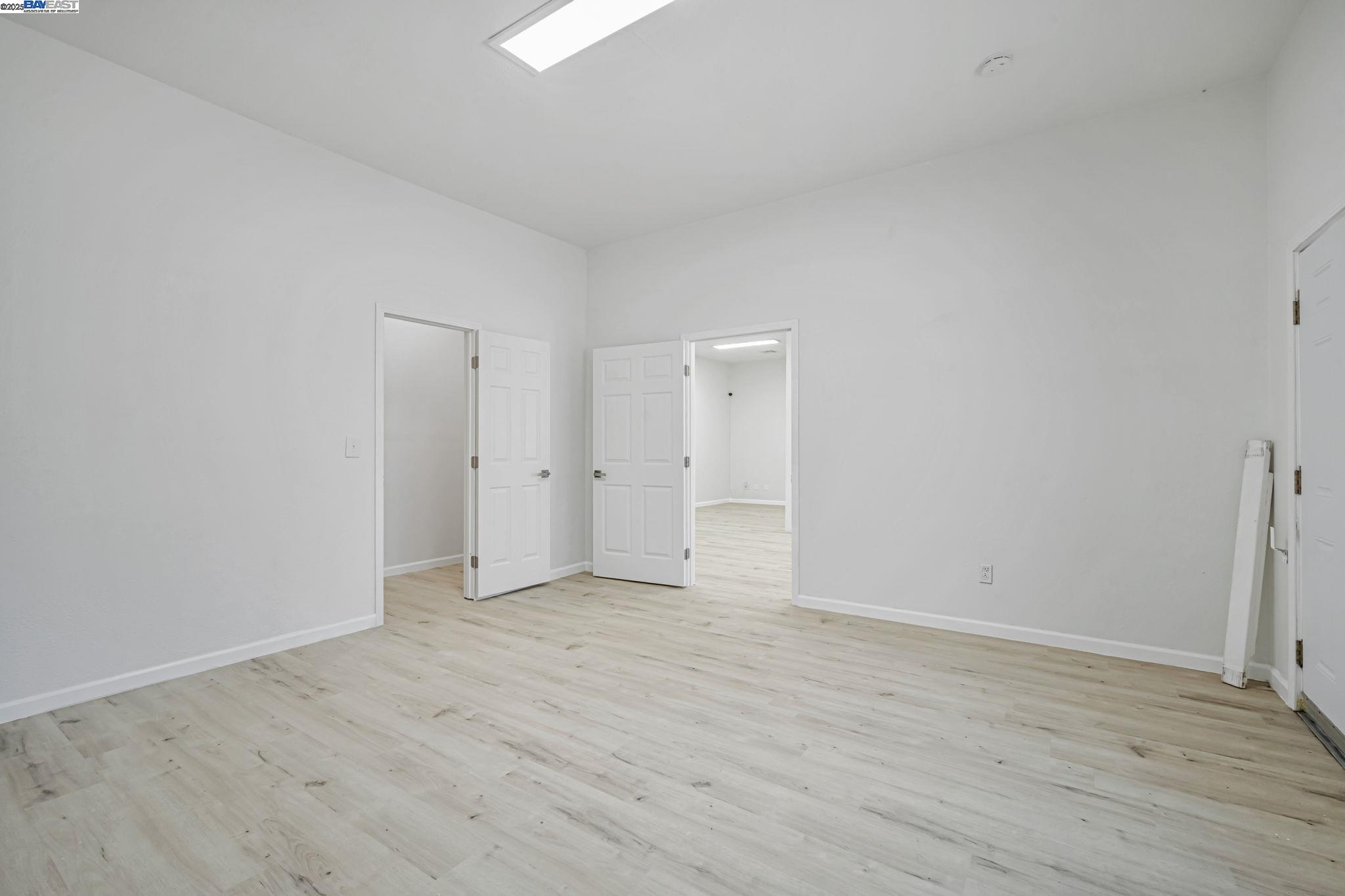 3920 Gravenstein Highway South Sebastopol, CA 95472 - Photo 18 of 48 a view of an empty room and wooden floor