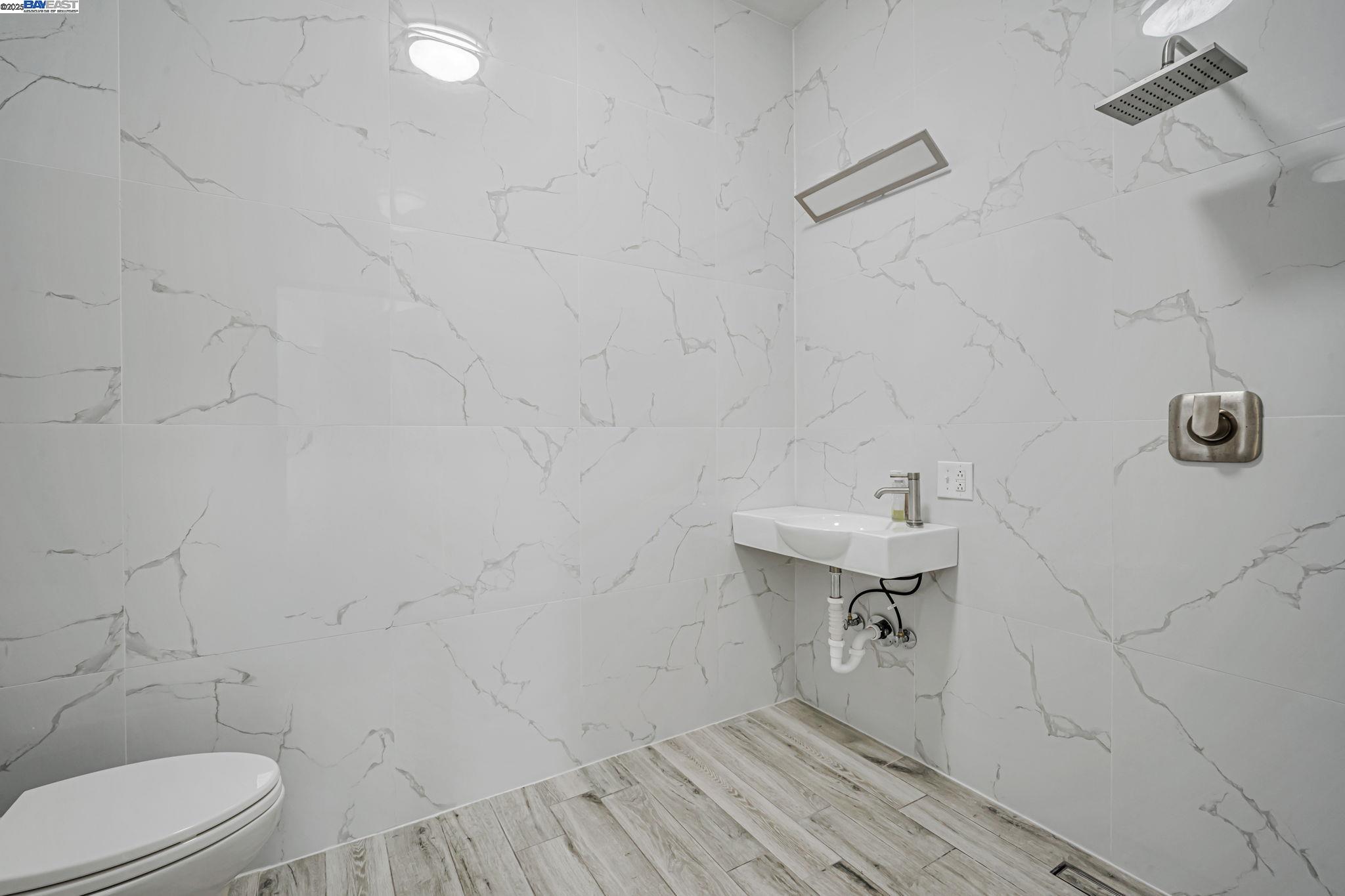 3920 Gravenstein Highway South Sebastopol, CA 95472 - Photo 30 of 48 a bathroom with a sink toilet and vanity