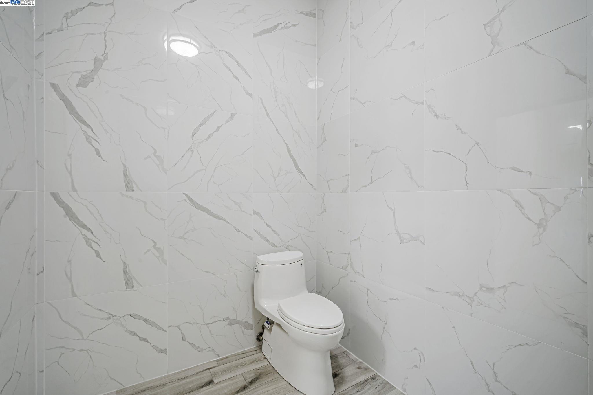 3920 Gravenstein Highway South Sebastopol, CA 95472 - Photo 31 of 48 a white toilet sitting next to a white wall