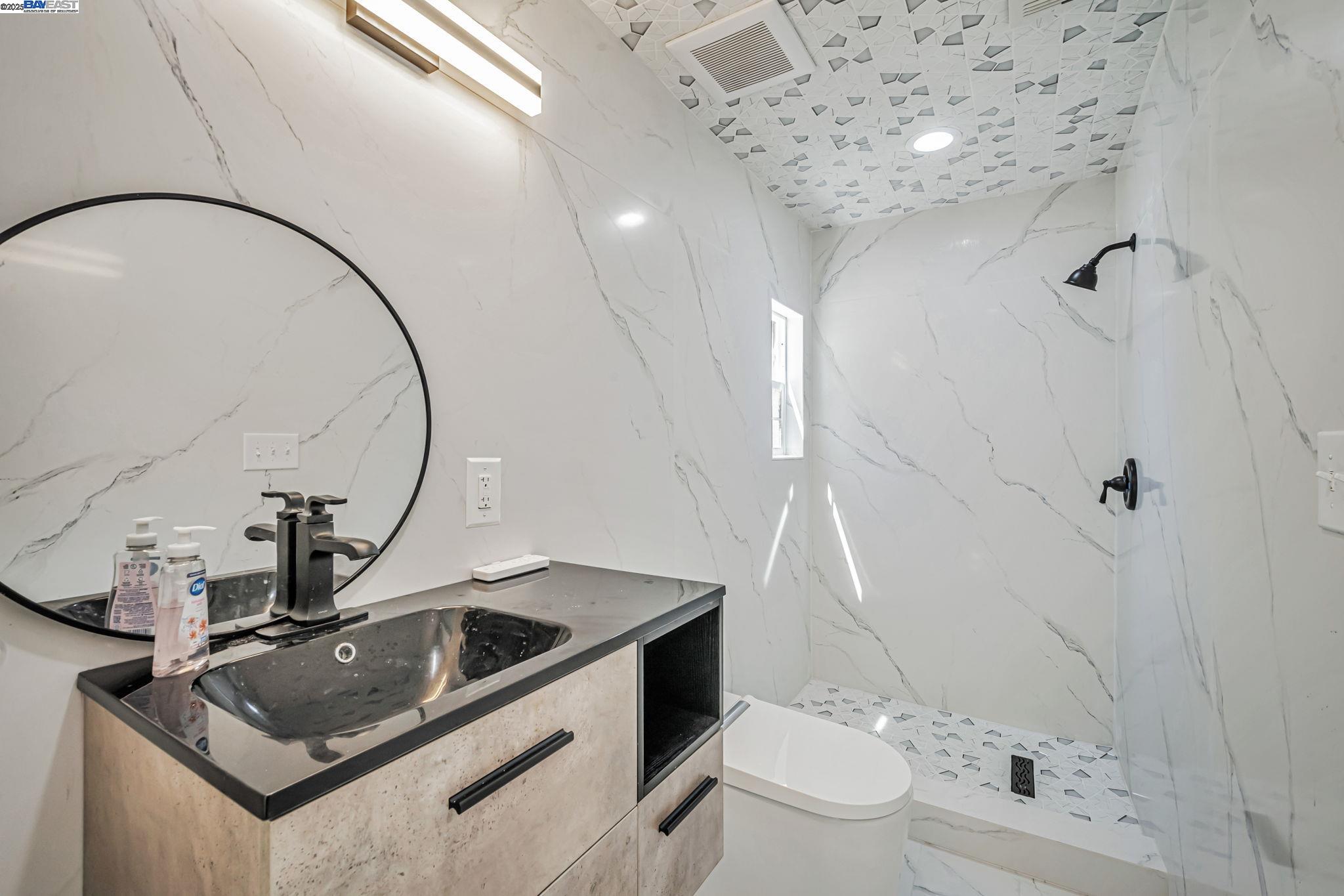 3920 Gravenstein Highway South Sebastopol, CA 95472 - Photo 32 of 48 a bathroom with a sink a toilet and shower