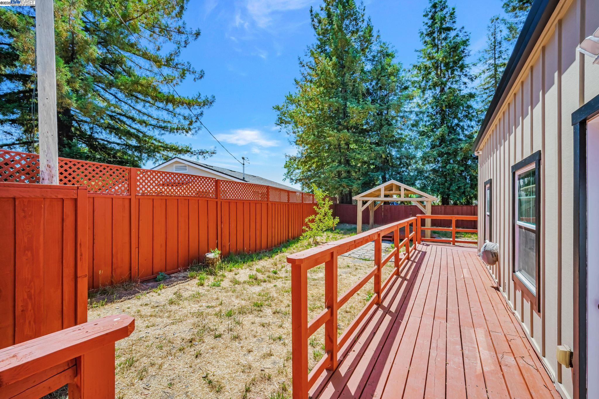 3920 Gravenstein Highway South Sebastopol, CA 95472 - Photo 34 of 48 a view of balcony with wooden floor and fence
