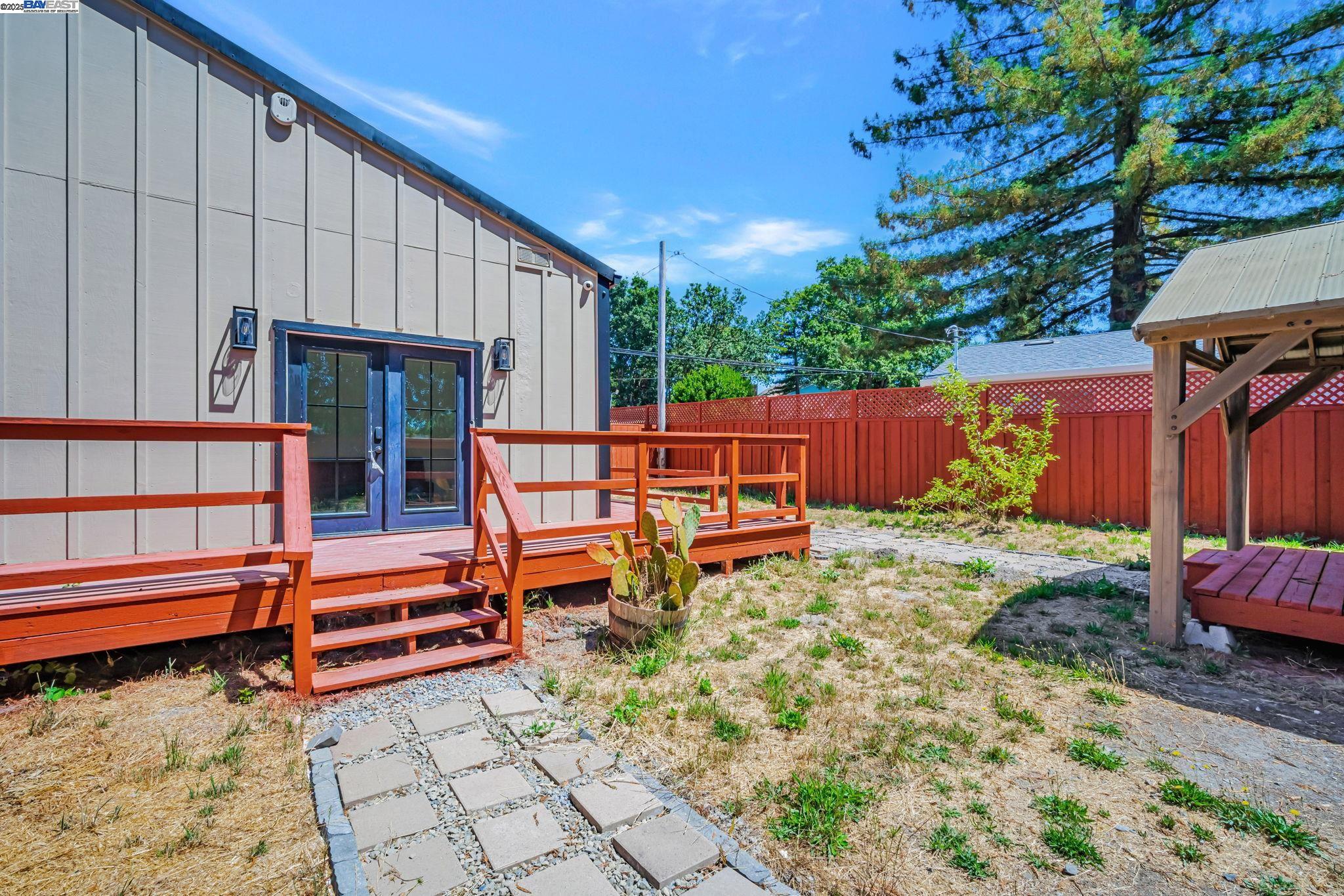 3920 Gravenstein Highway South Sebastopol, CA 95472 - Photo 38 of 48 a backyard of a house with barbeque oven table and chairs