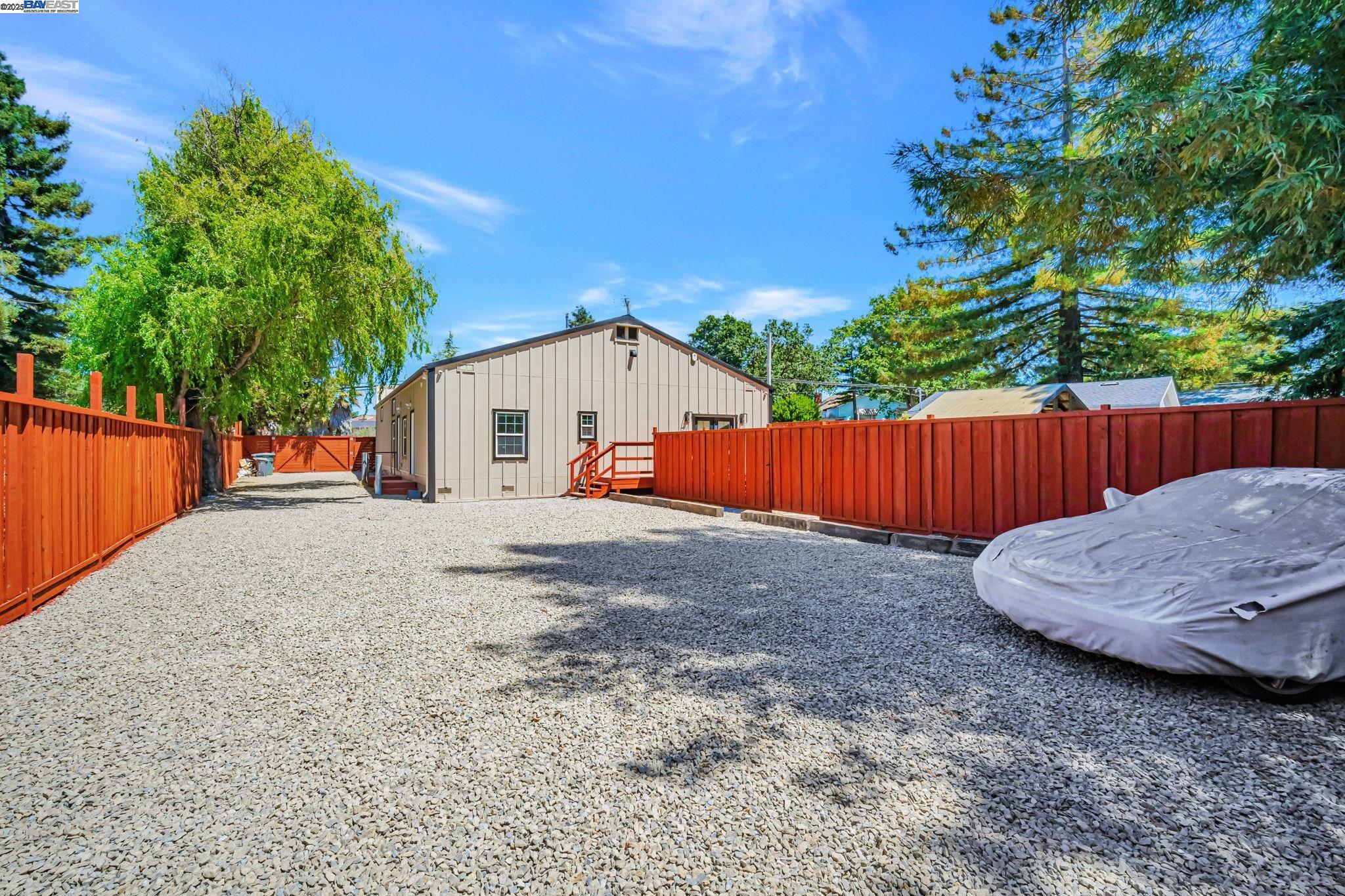 3920 Gravenstein Highway South Sebastopol, CA 95472 - Photo 44 of 48 a view of a white house with wooden fence
