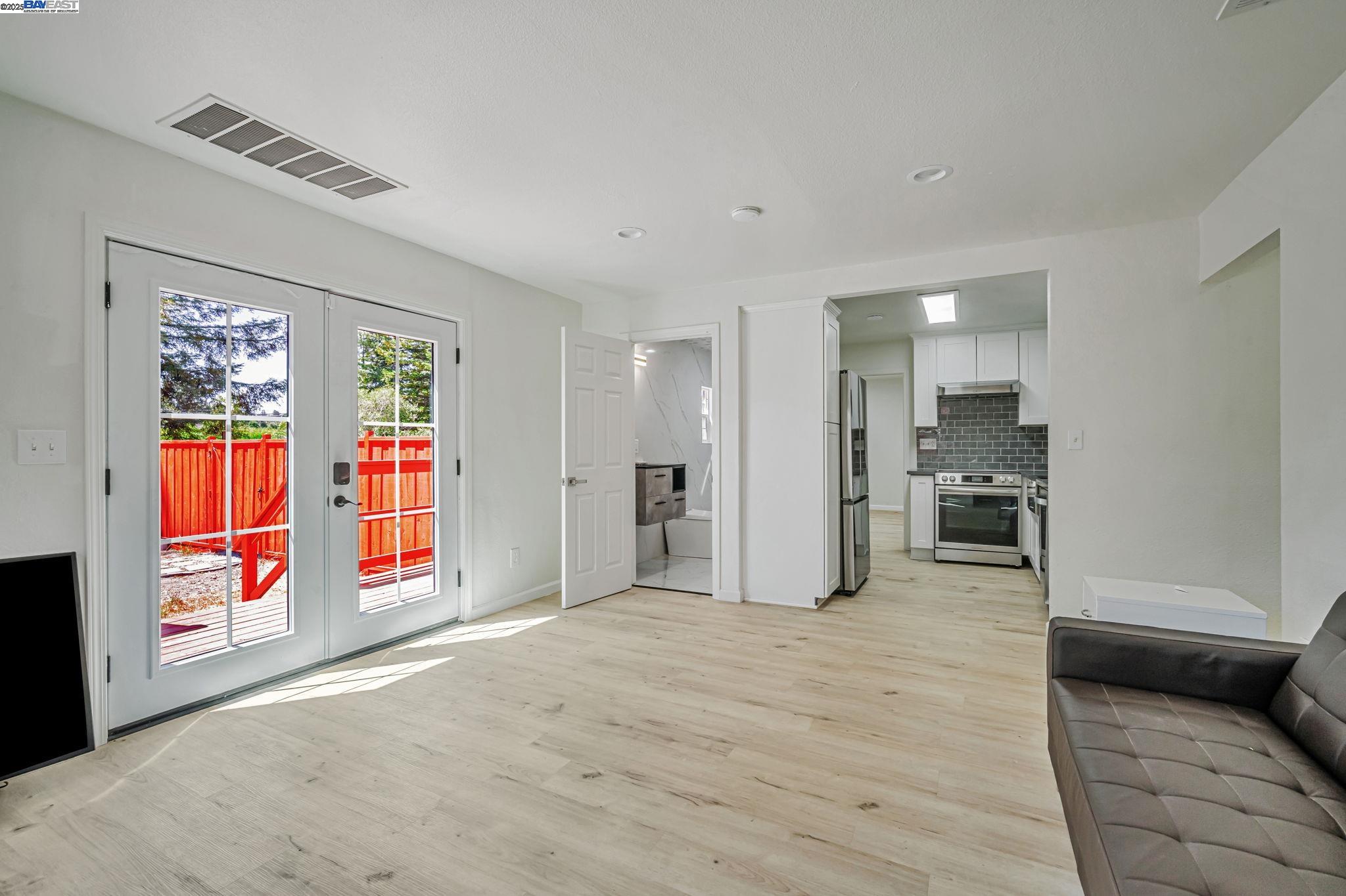 3920 Gravenstein Highway South Sebastopol, CA 95472 - Photo 10 of 48 a view of an empty room with window and kitchen view