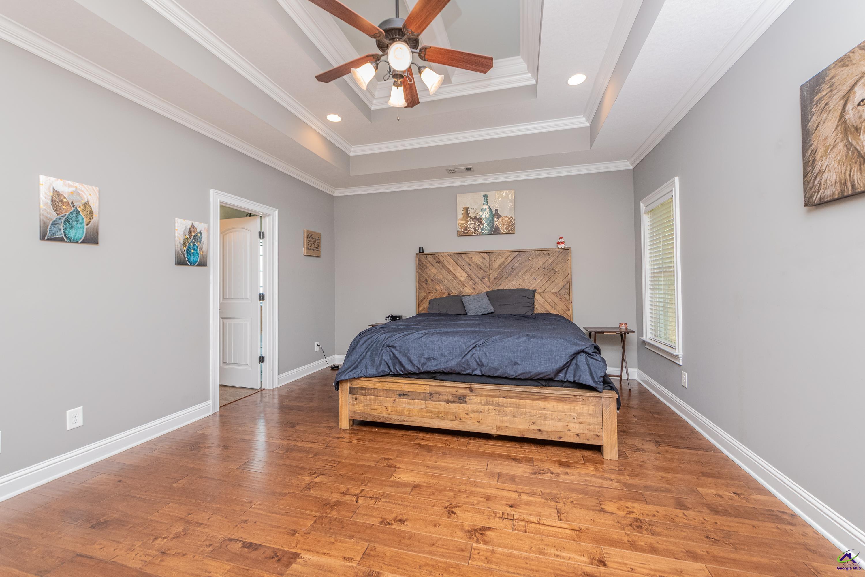 405 Old Bridge Road Warner Robins, GA 31088 - Photo 19 of 58 a bedroom with a bed and wooden floor