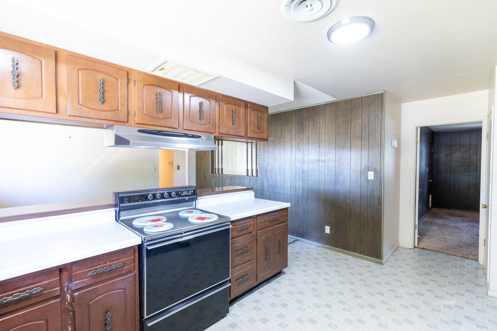 1125 South Norma Street Ridgecrest, CA 93555 - Photo 15 of 34 a kitchen with granite countertop a stove and a sink