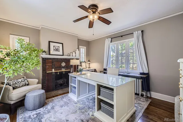 a kitchen with a stove refrigerator dining table and chairs