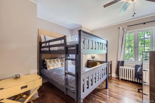 a bedroom with furniture and a window