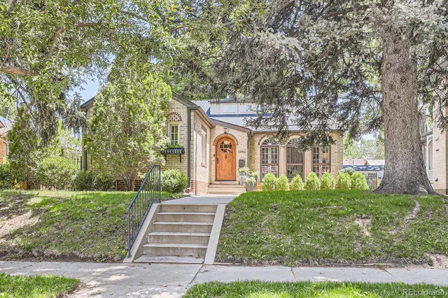 a front view of a house with garden