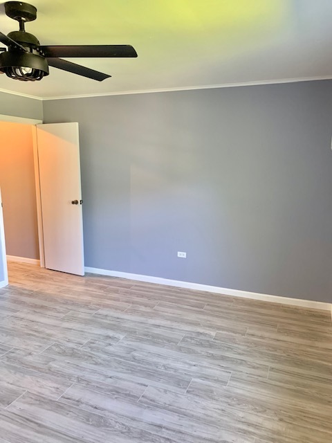 879 Trace Drive, Unit 202 Buffalo Grove, IL 60089 - Photo 14 of 18 a view of an empty room and wooden floor