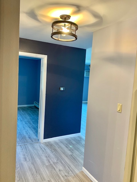 879 Trace Drive, Unit 202 Buffalo Grove, IL 60089 - Photo 5 of 18 a view of a hallway with wooden floor