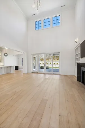 a kitchen with stainless steel appliances granite countertop a sink a refrigerator and a stove
