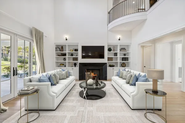 a kitchen with stainless steel appliances granite countertop a sink a stove and a refrigerator