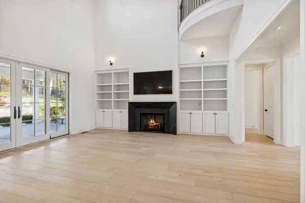 a kitchen with white cabinets and appliances