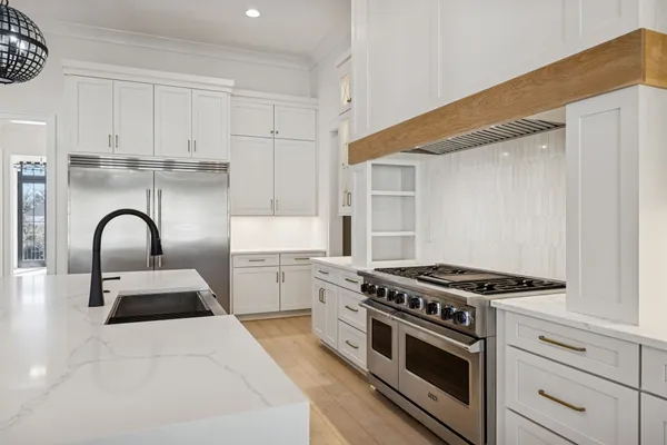 a view of an empty room with a staircase