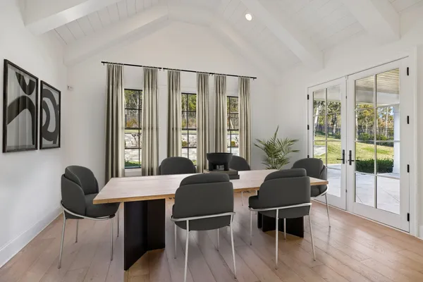 a view of an empty room with a fireplace and a window
