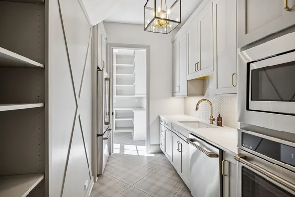 a bathroom with a double vanity sink mirror and shower